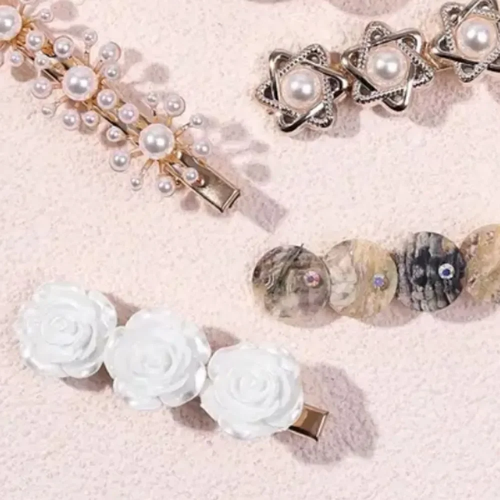 6 piece goldtone pearl shell clip set